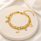 Gold layered moon and star charm bracelet for women