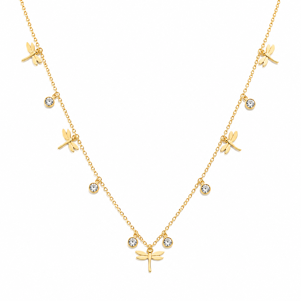 A delicate gold necklace featuring multiple dragonfly charms and small round bezel-set clear stones, displayed on a clean white background.