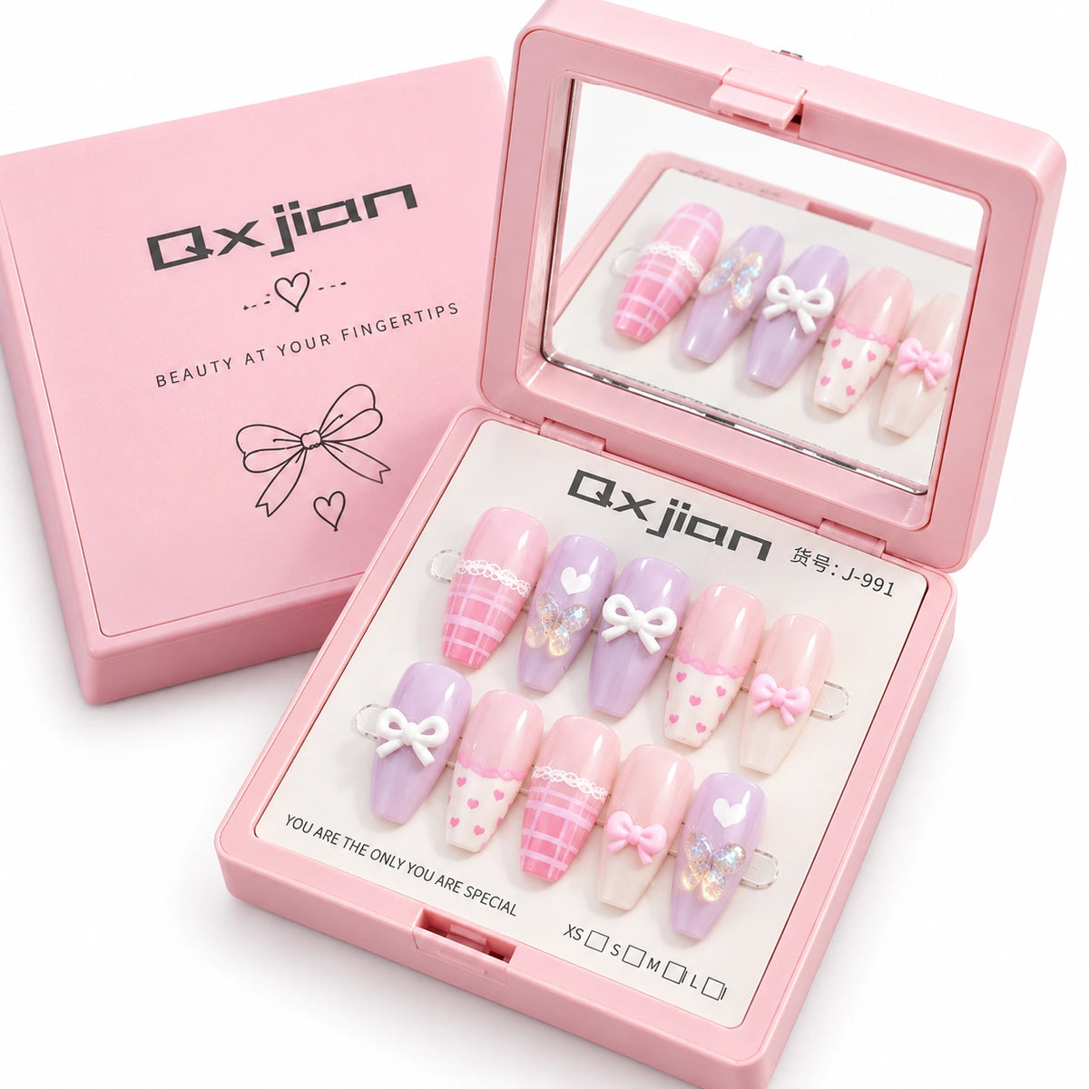 Pink press-on nail kit by Qxjian, showing an open compact with ten pastel artificial nails decorated with bows, polka dots, and plaid patterns, alongside the matching pink box.